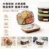 The transparent compartmented medicine box with golden fasteners contains multi-color tablets stacked beside the white and green sealed medicine box full image